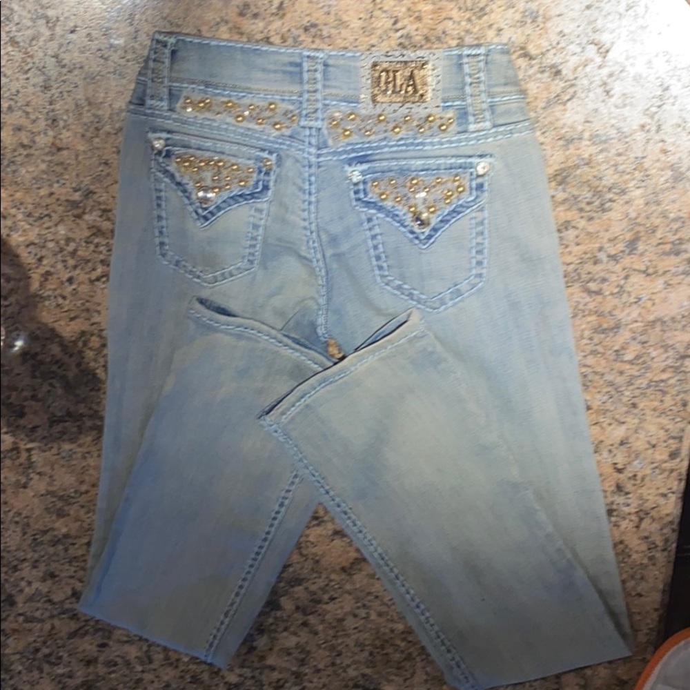 Light washed flared jeans by grace in la